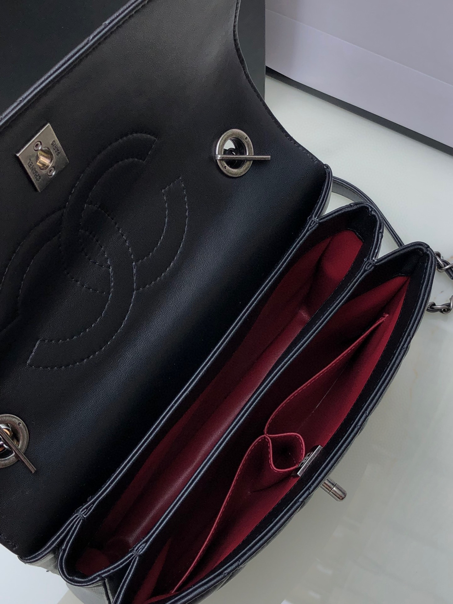 Ch*el flap bag with top handle 6.6 × 9.8 × 4.7 in